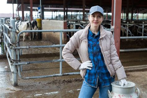 Female Farmer Standing Near Cowshed at Dairy Farm with Milk Churn Stock Photo - Image of dairy ...