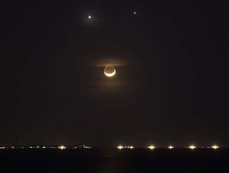 Venus and Jupiter cuddle in the night sky