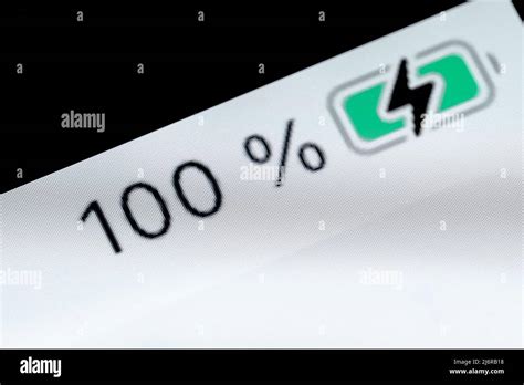 Smartphone full charged battery level indicator - 100 percent: close up macro Stock Photo - Alamy