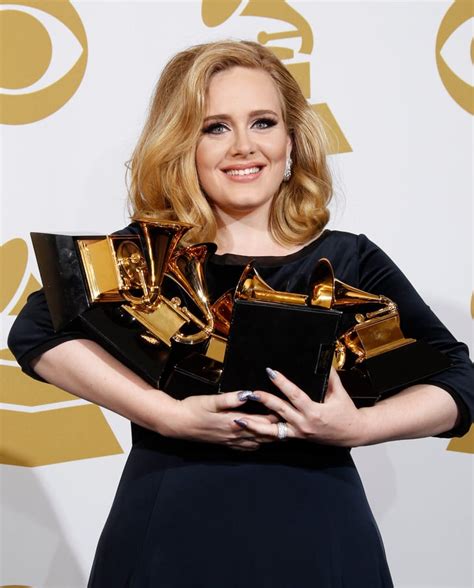 Adele held on to her Grammy Awards in the press room during the 2012 | Best Grammy Awards ...