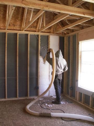 Blown fiberglass insulation fills netted wall cavities | Building America Solution Center