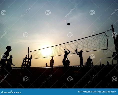 Beach volleyball sunset stock photo. Image of playing - 117346068