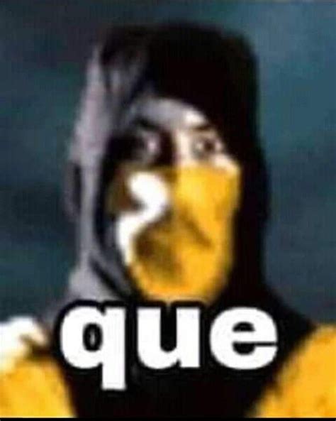 a man with his face painted yellow and wearing a black hoodie that says que