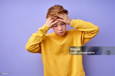 Teenage Boy Is Suffering From Headache Touching Head Isolated On Purple Background Stock Photo ...