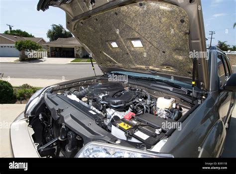 A broken down car with hood open for inspection Stock Photo - Alamy