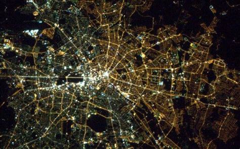 You can see the border of East/West Berlin from space by the ...