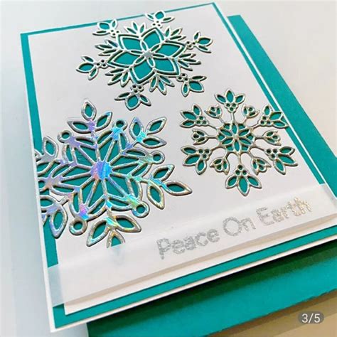 a close up of a greeting card with snowflakes on the front and back