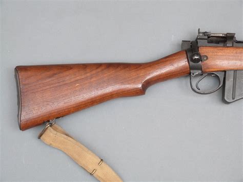 Deactivated Canadian Lee Enfield No4 Mk1 Long Branch .303 bolt action rifle with canvas sling, re