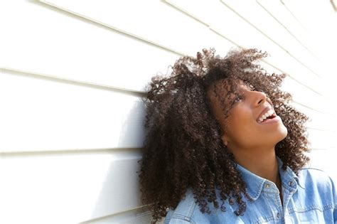 Premium Photo | Beautiful young woman laughing outdoors