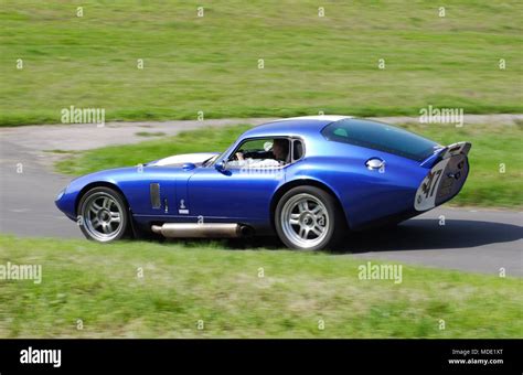 Blue Shelby Daytona Cobra 427 coupe rare American sports car driving fast Stock Photo - Alamy