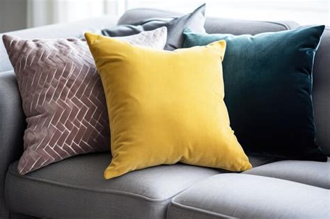 Premium AI Image | A trio of pillows in different colors on a sofa