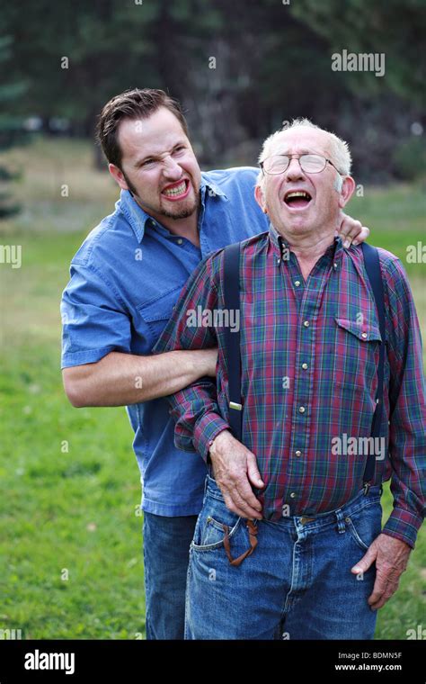 Man inflicting pain on senior citizen Stock Photo - Alamy