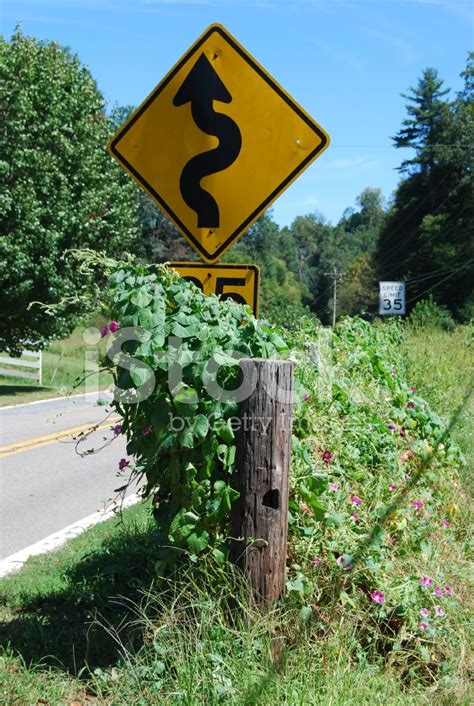 Curves Ahead Road Sign Stock Photo | Royalty-Free | FreeImages