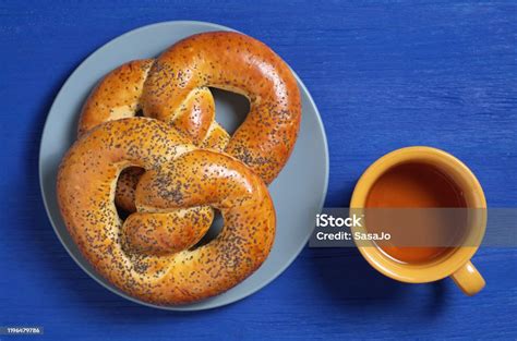 Poppy Pretzels And Tea Cup Stock Photo - Download Image Now - Bagel, Baked, Baked Pastry Item ...