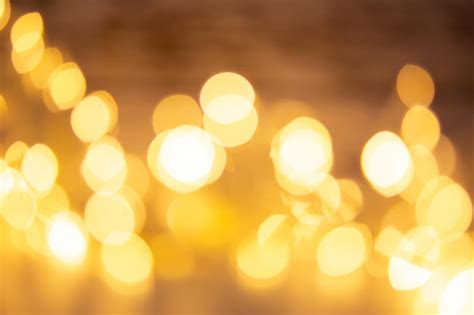 Premium Photo | Bokeh effect golden lights black background sparkling magic stars abstract ...