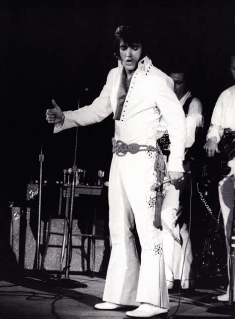 Elvis wearing the Nail Swirl jumpsuit. Also pictured to the rear, partially hidden, Charlie ...