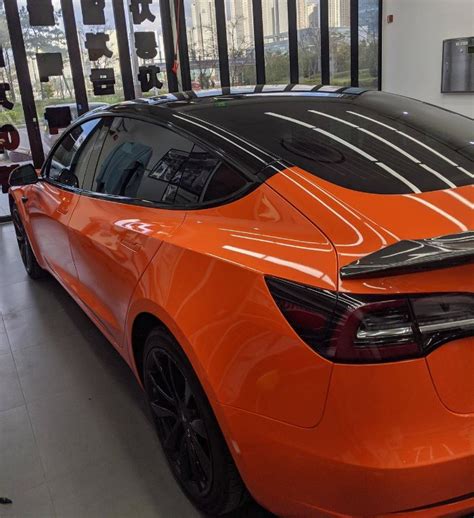 Gloss Orange Vinyl Wrapped Tesla Model 3 with Pillar Delete – Tesla Model 3 Wiki