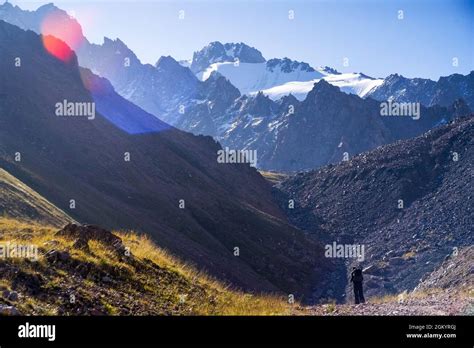 Traveler is hiking in the snowy mountains Stock Photo - Alamy