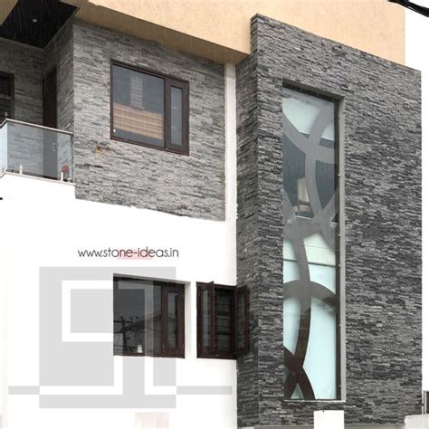 House front exterior featuring our stunning grey #wallcladding #tiles in the natural finish ...