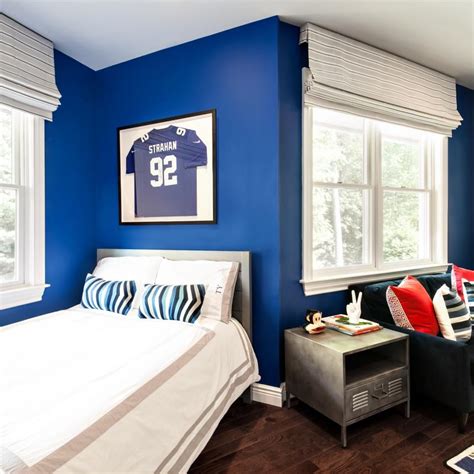 Royal blue bathes the walls of this kid's bedroom, a vibrant backdrop for treasured collectibles ...