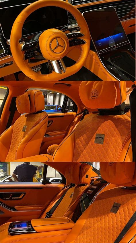 the interior of an orange colored car with leather seats and steering wheel covers on display