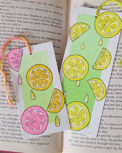 two bookmarks with lemons painted on them