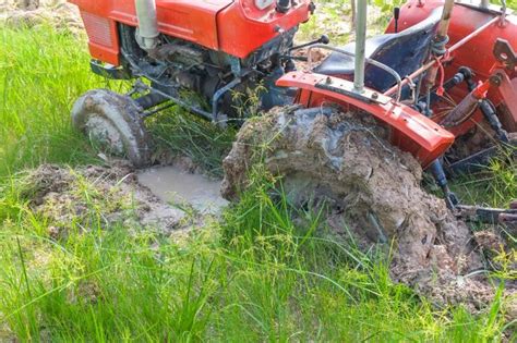 Getting a Tractor Out of Mud | Lawson, MO | Heavy Equipment Dealership