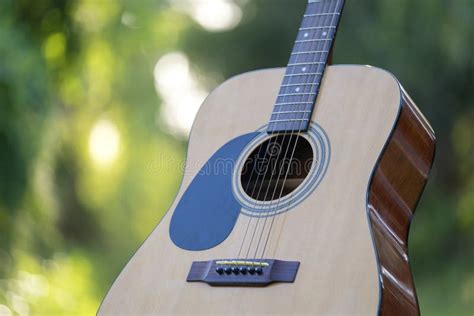 Acoustic Guitar Outdoors on Greenery Background. Concept of Calm Music ...