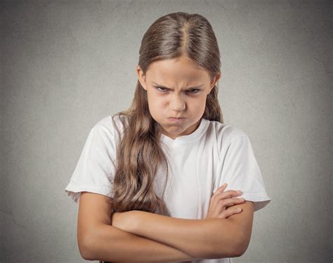 Headshot angry girl looking at you isolated on grey background - School Mum