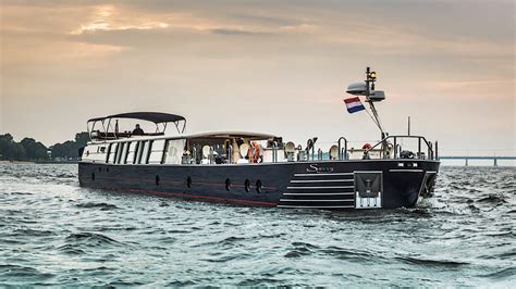 The World's First Luxury Superyacht Barge Cruises Canals in Style