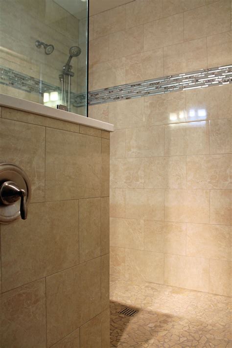 Large tile shower design. Travertine look wall tile, blue glass mosaics. #ideas | Shower tile ...
