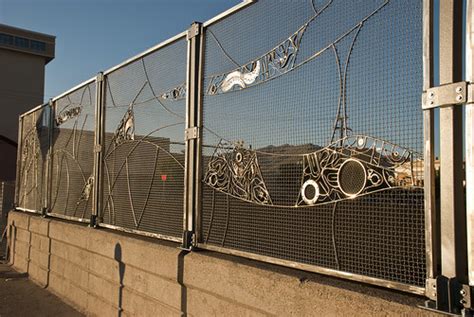 "Reclaimed Crossing" Stainless Steel Art fencing over Bata… | Flickr