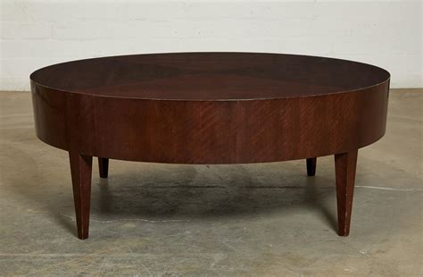 Lot - A contemporary mahogany low circular coffee table