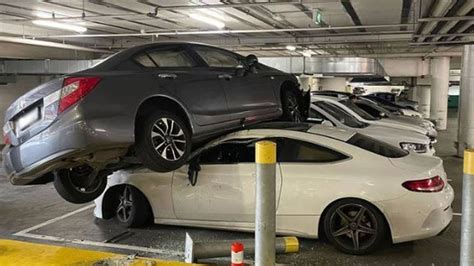 Mercedes squashed by another car in Sydney carpark crash