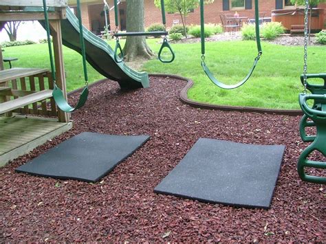 rubber mat under swings so you don't wear that mulched area down. also like the shape of the ...