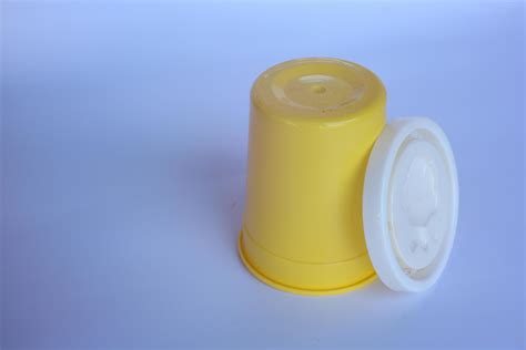 small yellow bottle on a plain white background. 16108816 Stock Photo at Vecteezy