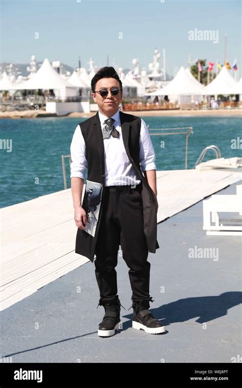 Chinese actor Huang Bo poses at a photocall for his movie "The Ghouls ...