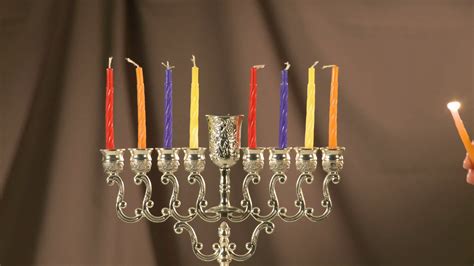 Lighting menorah with Hanukkah candles Stock Video Footage 00:34 SBV-302539689 - Storyblocks