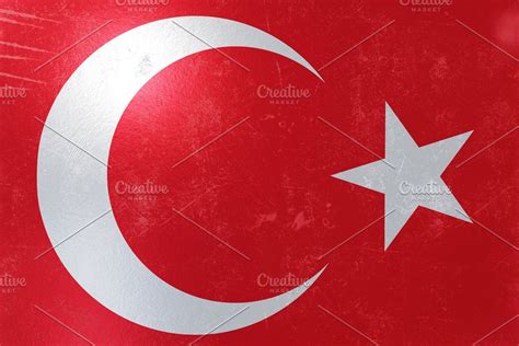 the flag of turkey on an old metal plate