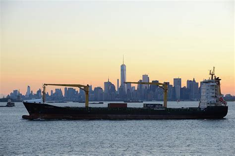 New York City skyline with passing container ship Photograph by Merijn Van der Vliet | Fine Art ...