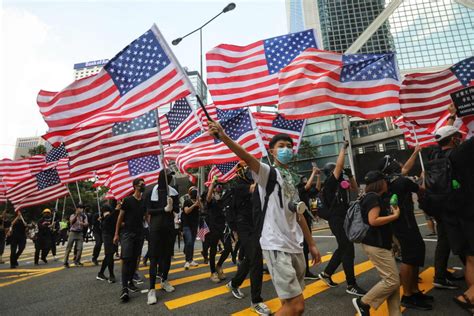 Hong Kong protesters call on Donald Trump to 'liberate' the territory as they march on US ...