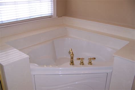 Original tub surround - white cultured marble - with a white cultured marble backsplash ...