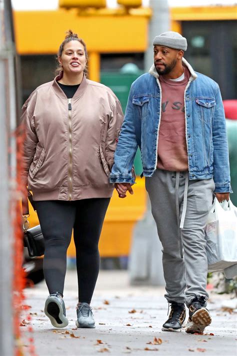 Ashley Graham shows her growing baby bump while out with her husband ...