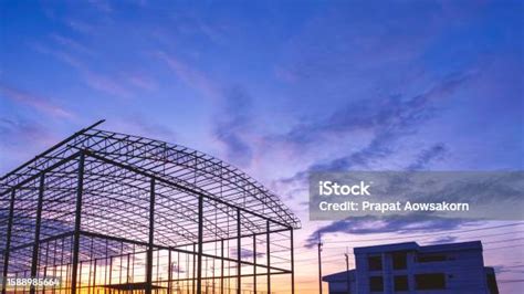 Silhouette Metal Warehouse Structure With Office Building In Construction Site Area Against ...