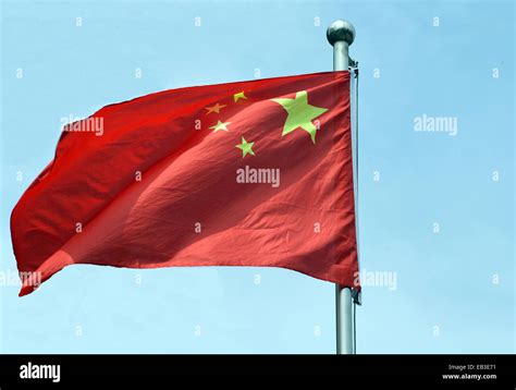 China flag in blue sky Stock Photo - Alamy