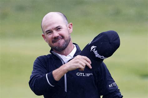 Brian Harman holds nerve to win Open Championship by six shots at rainy Hoylake