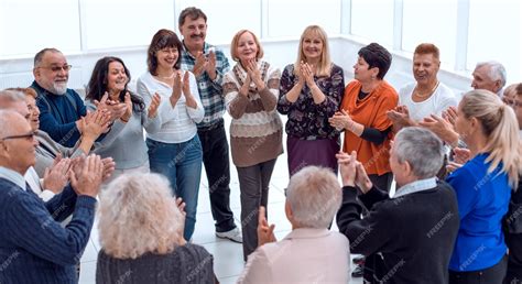 Premium Photo | A group of elderly people clap their hands