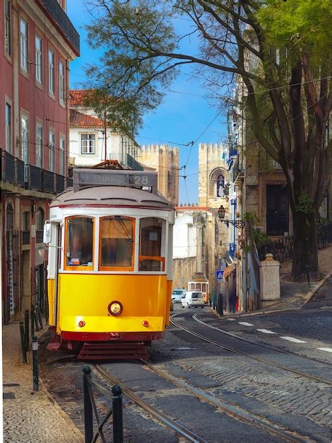 Premium Photo | Yellow 28 tram in alfama, lisbon, portugal