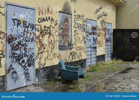 Vandalized Graffiti Wall and Two Modern Armchairs Stock Photo - Image of upside, chairs: 165112022