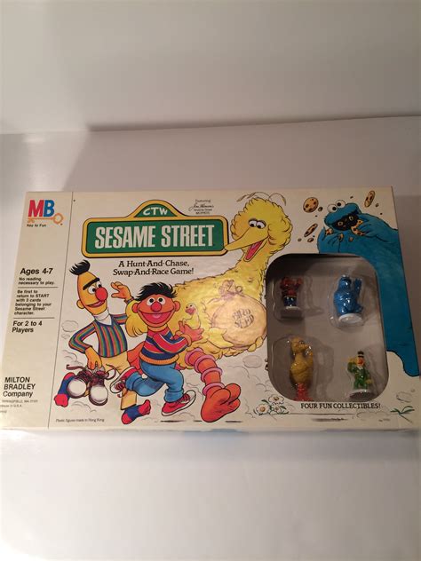 sesame street action figure set in its original box with instructions and pictures on the package